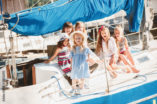 The children on board of sea yacht