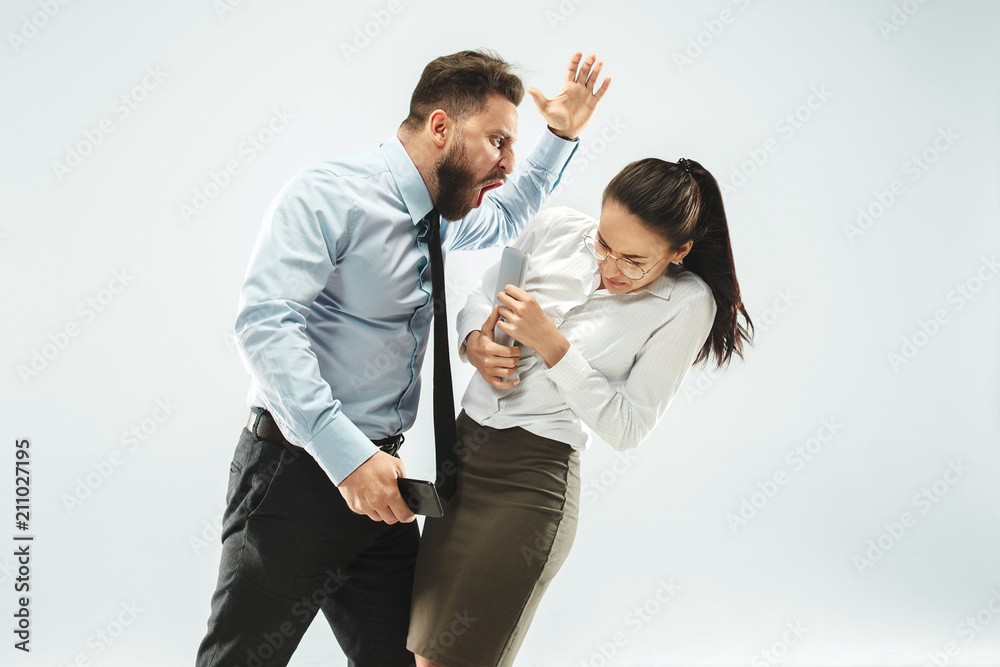 angry businessman and his colleague in the office.