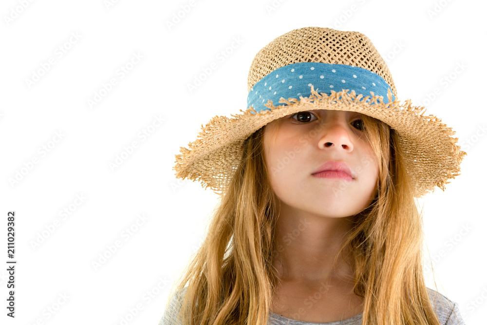 Serious little girl peering out from under a hat Serious little girl peering out from under a hat