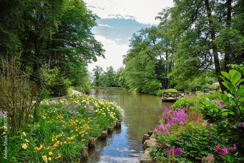 Summer in the arboretum Volcji potok near Kamnik  Slovenia  beautiful landscape with trees  water and flowers