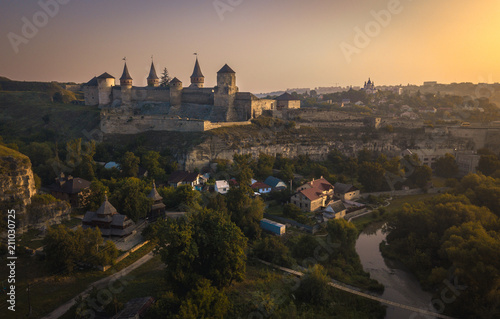 Kamianets-Podilskyi Castle during sunrise. Beautiful view of medieval fortress, one of the Seven Wonders of Ukraine.