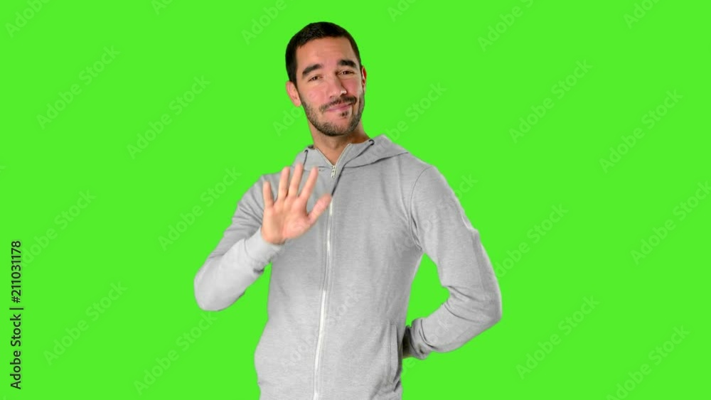Happy young man with a gesture of keep calm on chroma key Happy young man with a gesture of keep calm on chroma key