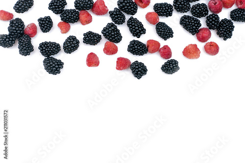 .Blackberry and red raspberry close-up on white isolated background.Copy space