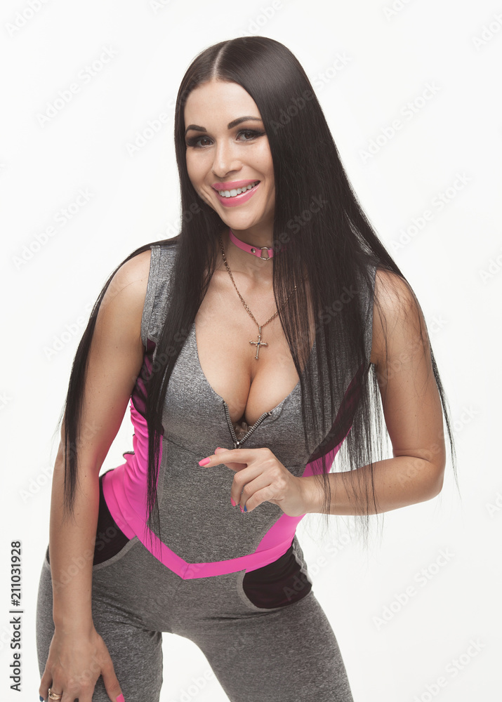 fitness woman in sport style standing against white background