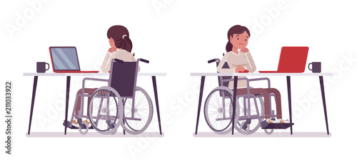 Female young wheelchair user at computer