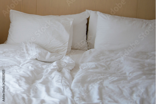 Crumpled bed linen in the morning. Bed for a couple in love.