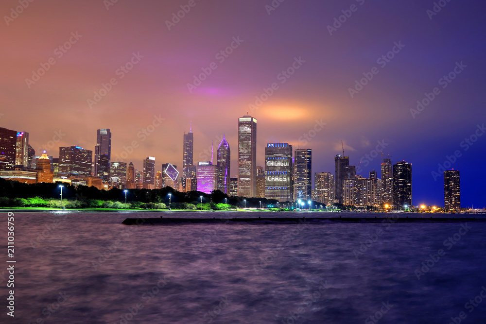 Chicago, Illinois, USA - June 22, 2018 - The Chicago skyline at night after a storm across Lake Michigan.