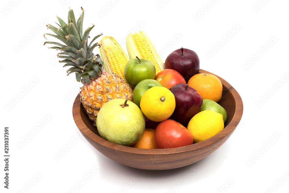 Assort fresh fruits and vegetables in basket isolated on white background Assort fresh fruits and vegetables in basket isolated on white background
