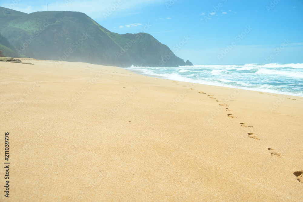 Footprints on deserted empty beach Footprints on deserted empty beach