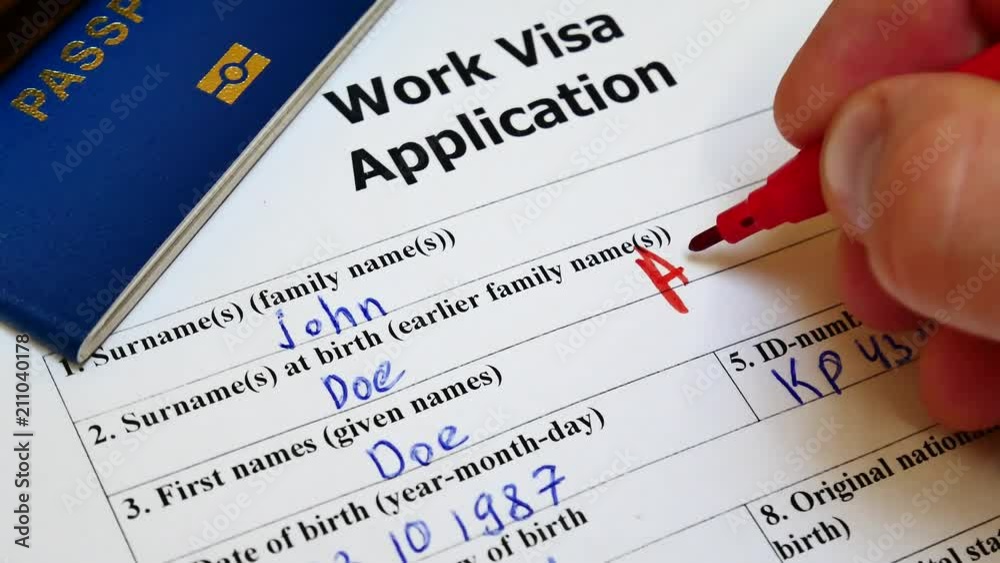 The decision to grant a visa. Pen voting approved in checkbox in blank Work Visa application form with passport and pen. Document with passport, apply and permission for foreigner country The decision to grant a visa. Pen voting approved in checkbox in blank Work Visa application form with passport and pen. Document with passport, apply and permission for foreigner country