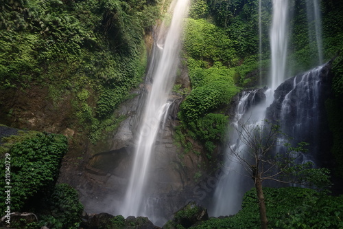 Sekumpul Beautiful waterfall Sekumpul in deep forest in Bali, Indonesia