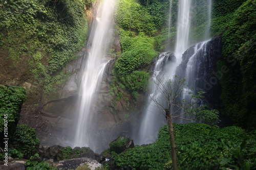 Sekumpul Beautiful waterfall Sekumpul in deep forest in Bali, Indonesia