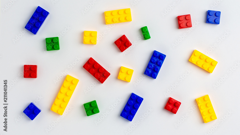 Plastic building blocks on white background