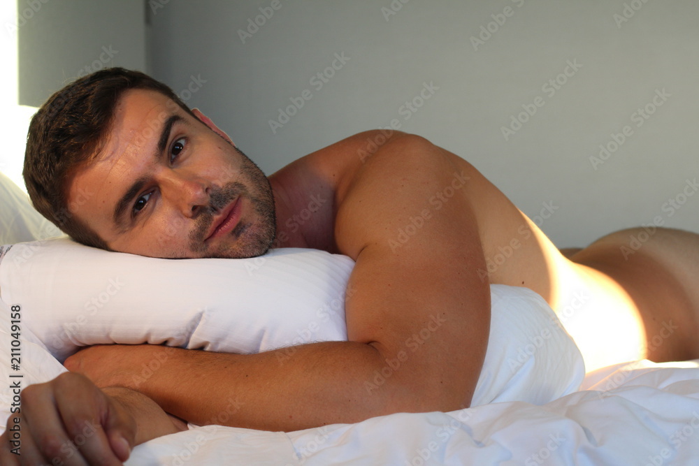 Handsome man naked in bed Handsome man naked in bed