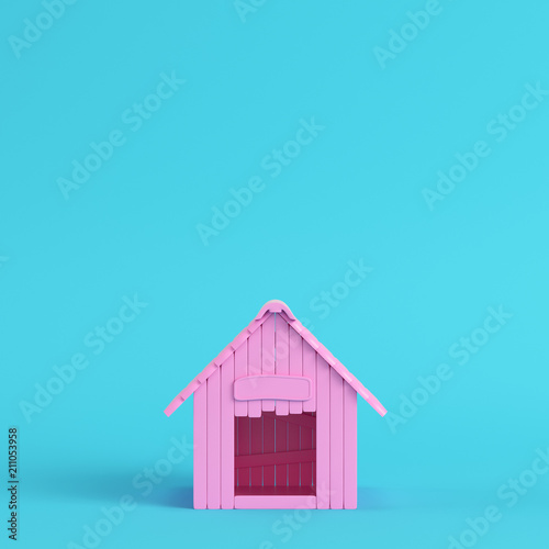 Foto Pink doghouse on bright blue background in pastel colors