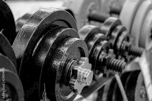 Rack with dumbbells. The concept of a healthy lifestyle. Sale of sports equipment.