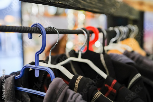 Hangers with clothes in second hand