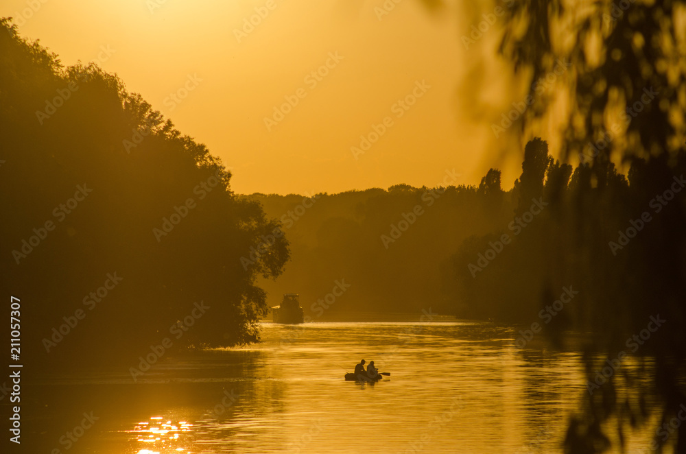 Ship on the river at sunset of the day