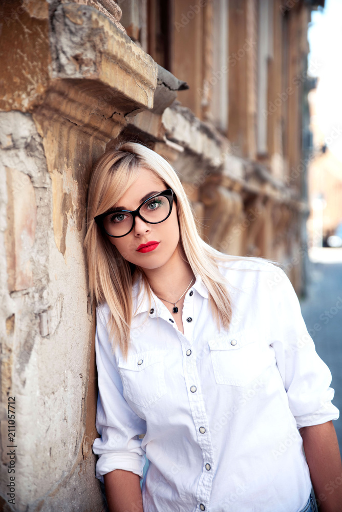 Young blonde woman wearing eyeglasses