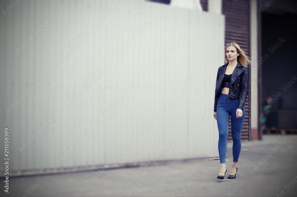 Woman walks down the street, man peeks behind Woman walks down the street, man peeks behind