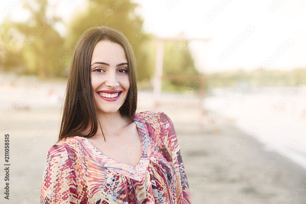 Young smiling woman on beach