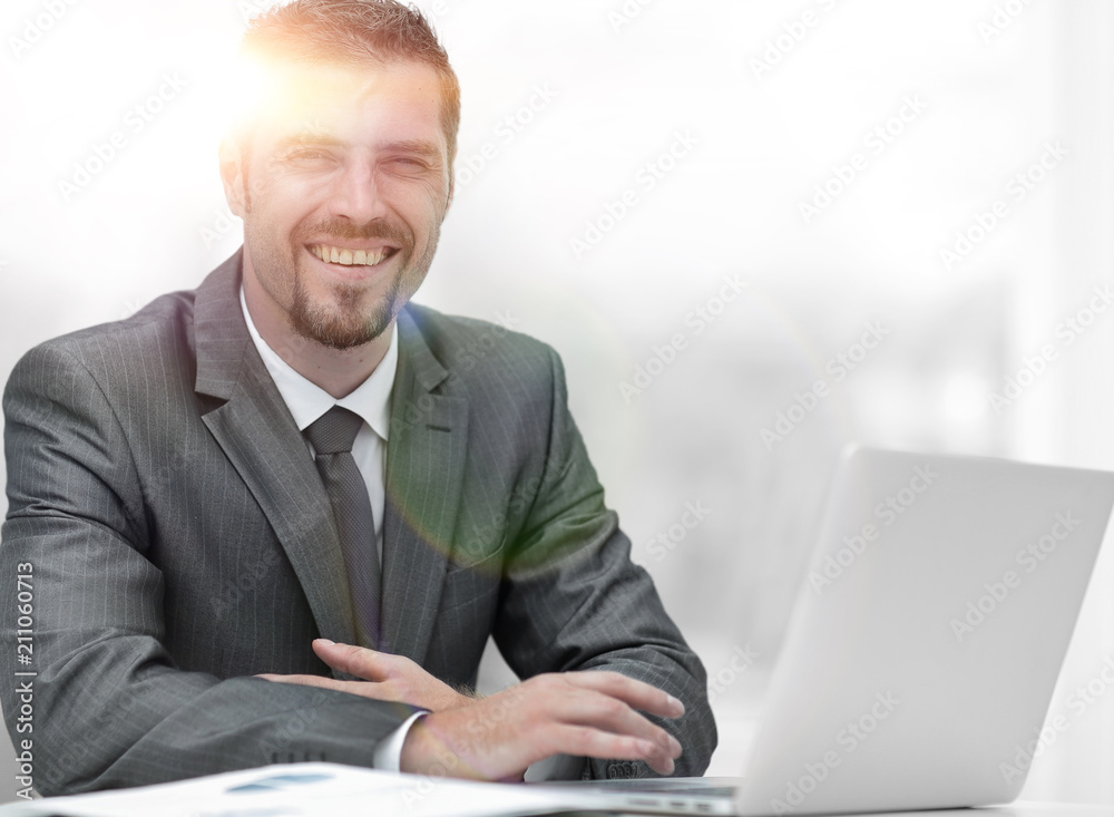 closeup.smiling businessman working with laptop closeup.smiling businessman working with laptop