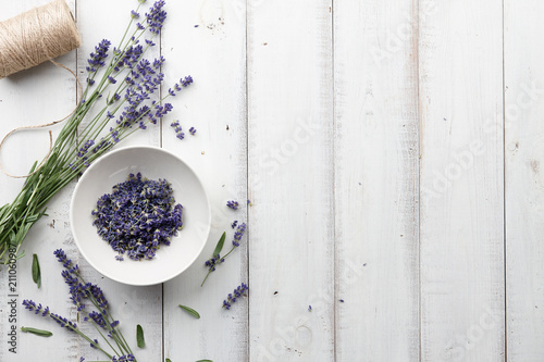 Fototapeta Naklejka Na Ścianę i Meble -  Lavender flowers on white wooden planks background, top view