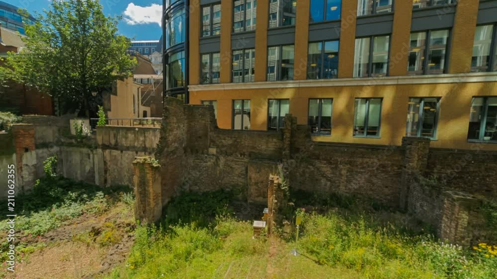Close-up shot revealing the ruins of a Roman compound dating from AD 200 next to modern corporate buildings in London, England, UK Close-up shot revealing the ruins of a Roman compound dating from AD 200 next to modern corporate buildings in London, England, UK