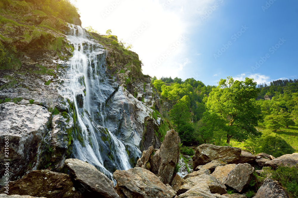 Majestic water cascade of Powerscourt Waterfall, the highest waterfall in Ireland.