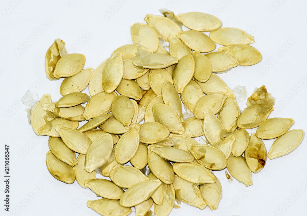 Seeds of zucchini on white background. Courgettes Seeds of zucchini on white background. Courgettes