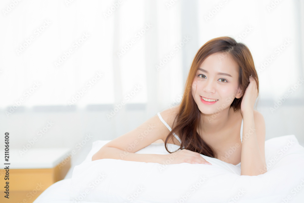 Beautiful portrait young asian woman lying and smile while wake up with sunrise at morning, lifestyle and relax concept. Beautiful portrait young asian woman lying and smile while wake up with sunrise at morning, lifestyle and relax concept.