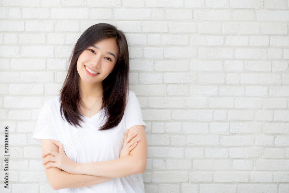 Portrait of beautiful young asian woman happiness standing on gray cement texture grunge wall brick background, businesswoman is a smiling on concrete, business people concept. Portrait of beautiful young asian woman happiness standing on gray cement texture grunge wall brick background, businesswoman is a smiling on concrete, business people concept.