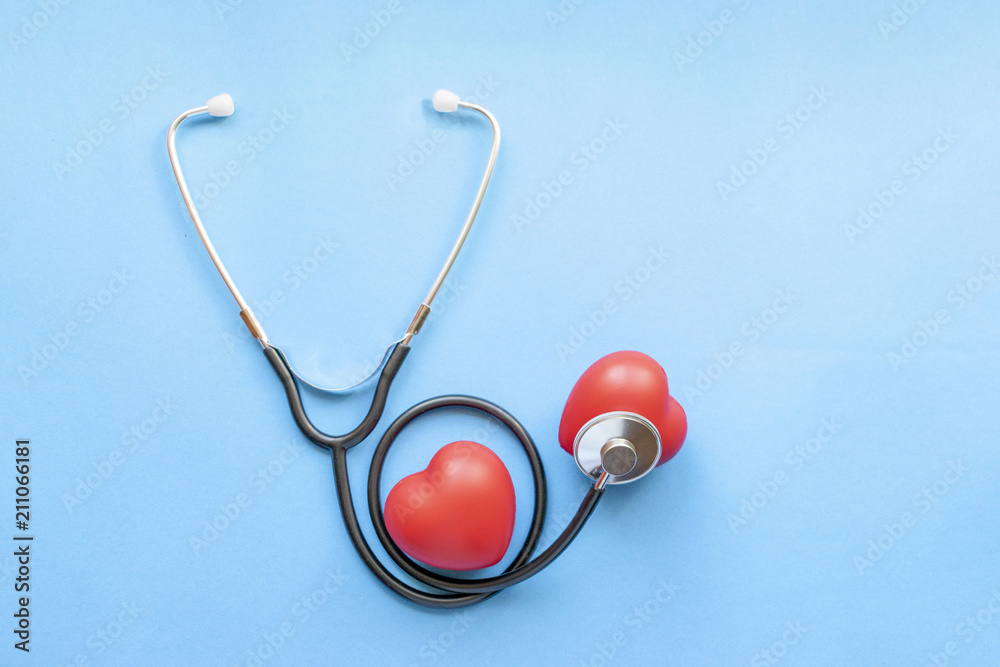 Cardiologist's day, heart disease, Cardiology, black stethoscope with two red hearts on a blue background, diagnosis of heart disease Cardiologist's day, heart disease, Cardiology, black stethoscope with two red hearts on a blue background, diagnosis of heart disease