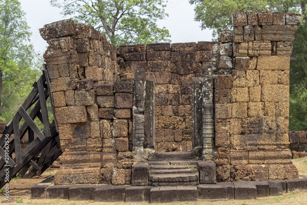 Ancient temple stone ruin in Angkor Wat temple. Ancient temple restoration. Angkor Wat landscape.