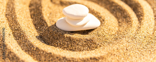 Photography zen meditation stone in sand, concept for purity harmony and spirituality, spa w