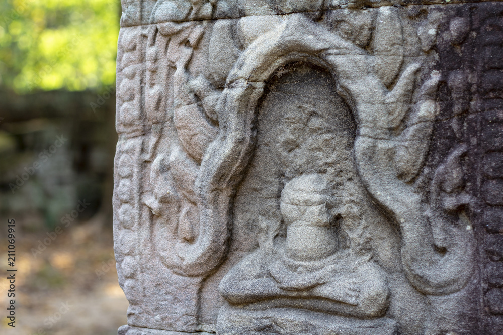 Ancient stone bas-relief in Angkor Wat, Cambodia. Ancient temple decor. Angkor Wat detail.