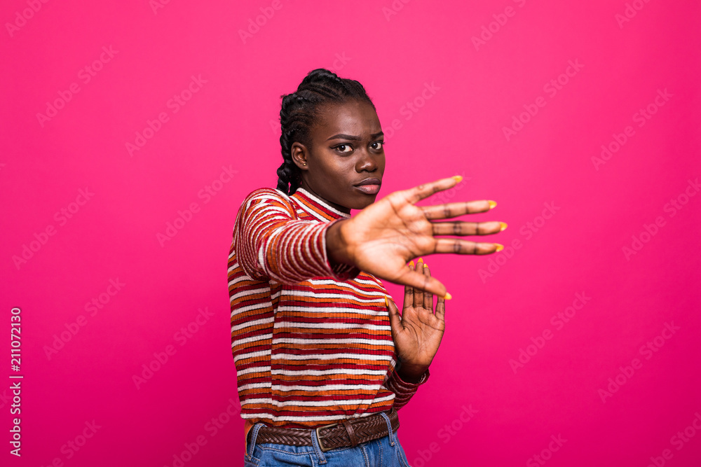 African american woman doing stop gesture with sad and fear expression. Embarrassed and negative concept. African american woman doing stop gesture with sad and fear expression. Embarrassed and negative concept.