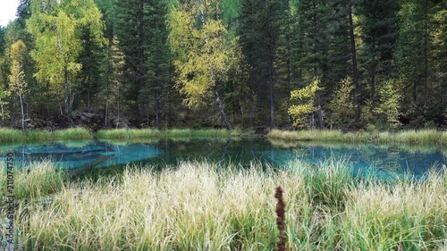 Blue Geyser lake in Altai mountains in rainy Autumn day 