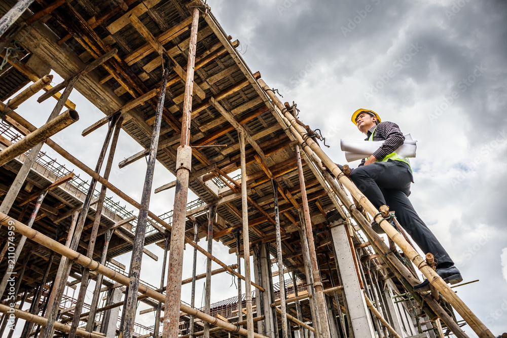 professional engineer worker at the house building construction site professional engineer worker at the house building construction site