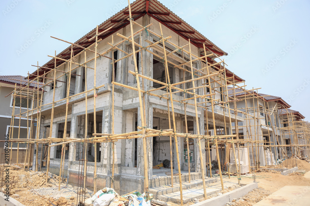 house under construction with autoclaved aerated concrete block structure at building site