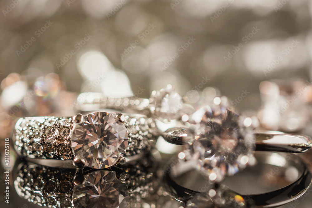 Luxury Jewelry diamond rings with reflection on black background Luxury Jewelry diamond rings with reflection on black background