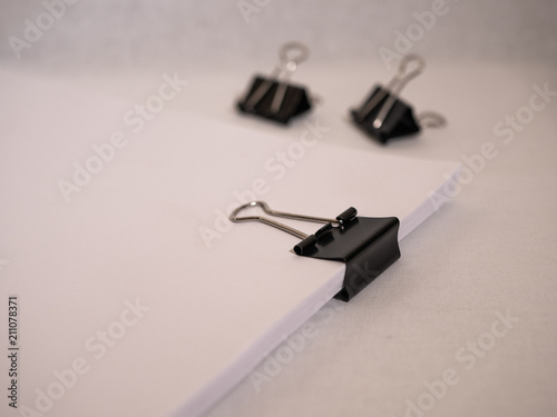 Binder clips and paper