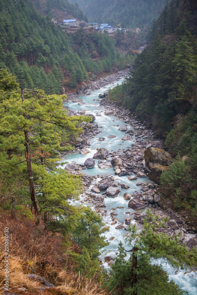 Beautiful river and mountains landscape in forest during trekking route to the Everest Base Camp Beautiful river and mountains landscape in forest during trekking route to the Everest Base Camp