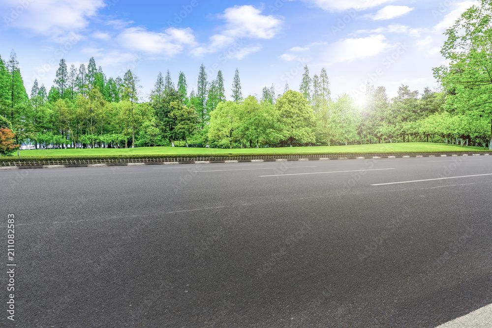 Asphalt road square and river hill under the blue sky