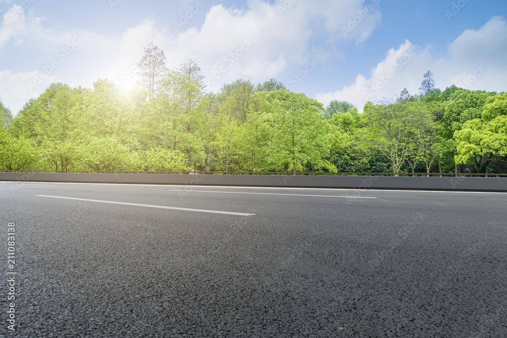 Asphalt road square and river hill under the blue sky Asphalt road square and river hill under the blue sky