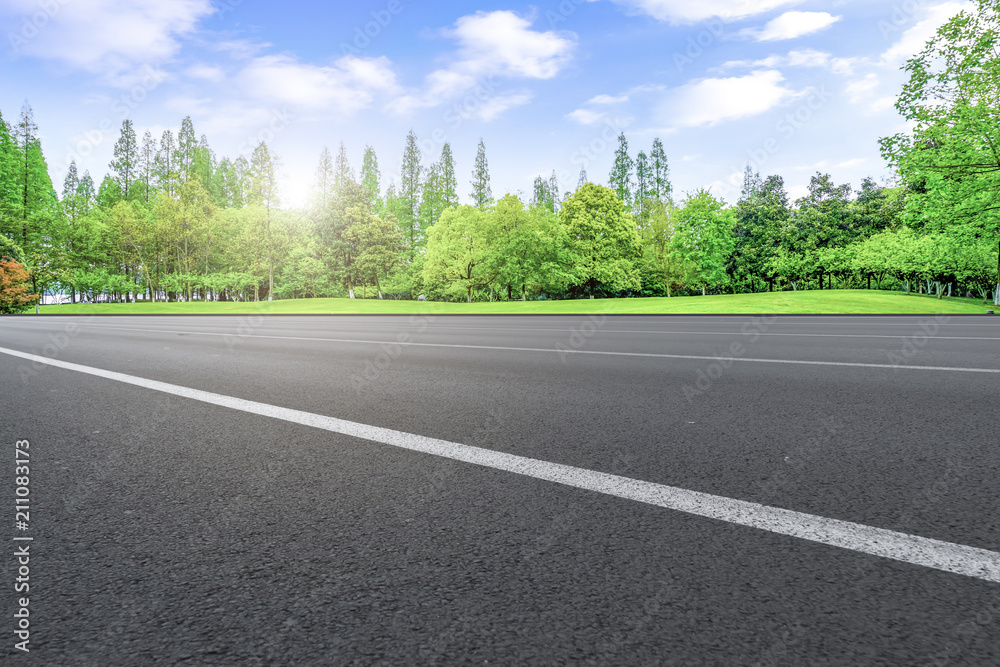 Fototapeta premium Asphalt road square and river hill under the blue sky