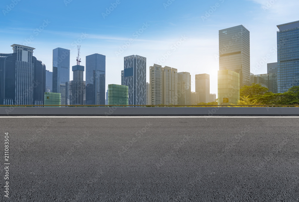 empty road with panoramic cityscape