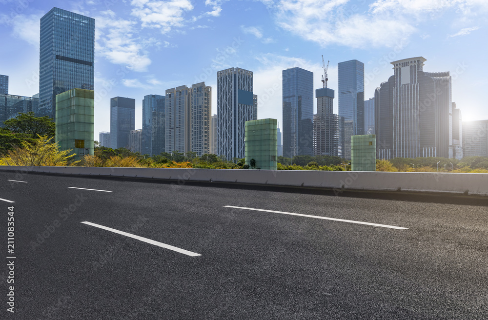 empty road with panoramic cityscape empty road with panoramic cityscape