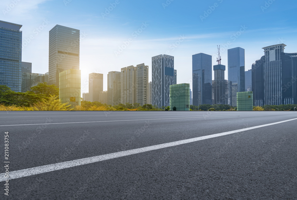 empty road with panoramic cityscape empty road with panoramic cityscape