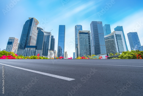 empty road with panoramic cityscape © 昊 周